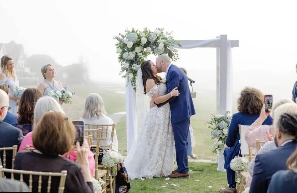 Traditional white wedding arch
