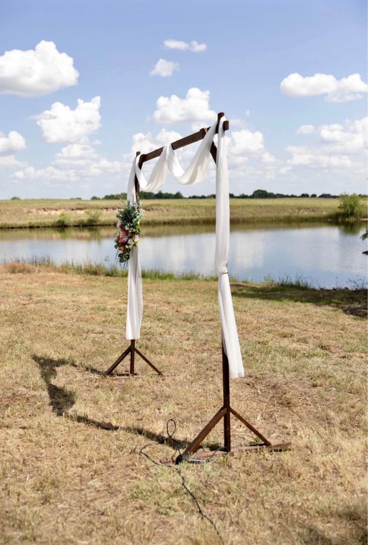 Modern wood beam arch ceremony setup