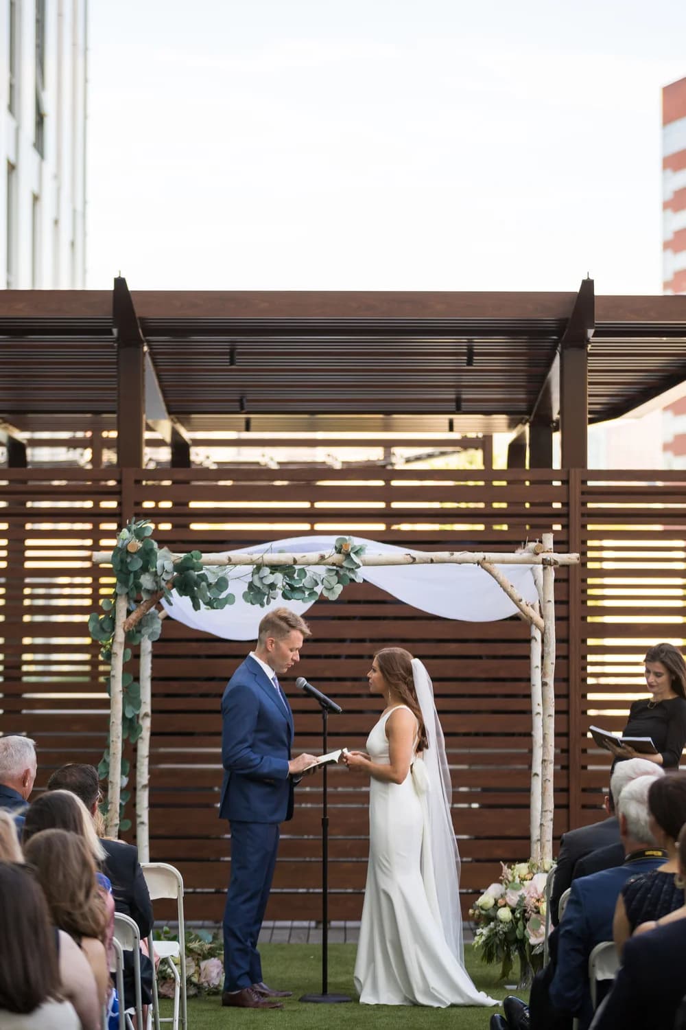 White birch wedding canopy at a ceremony