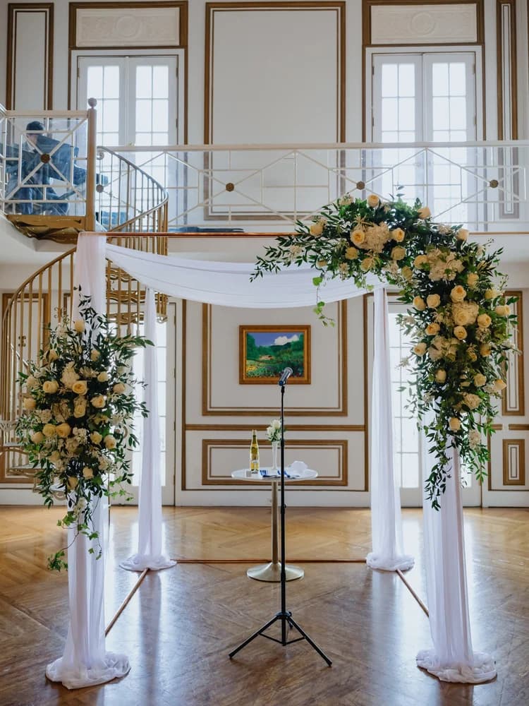 Copper wedding canopy with floral accents