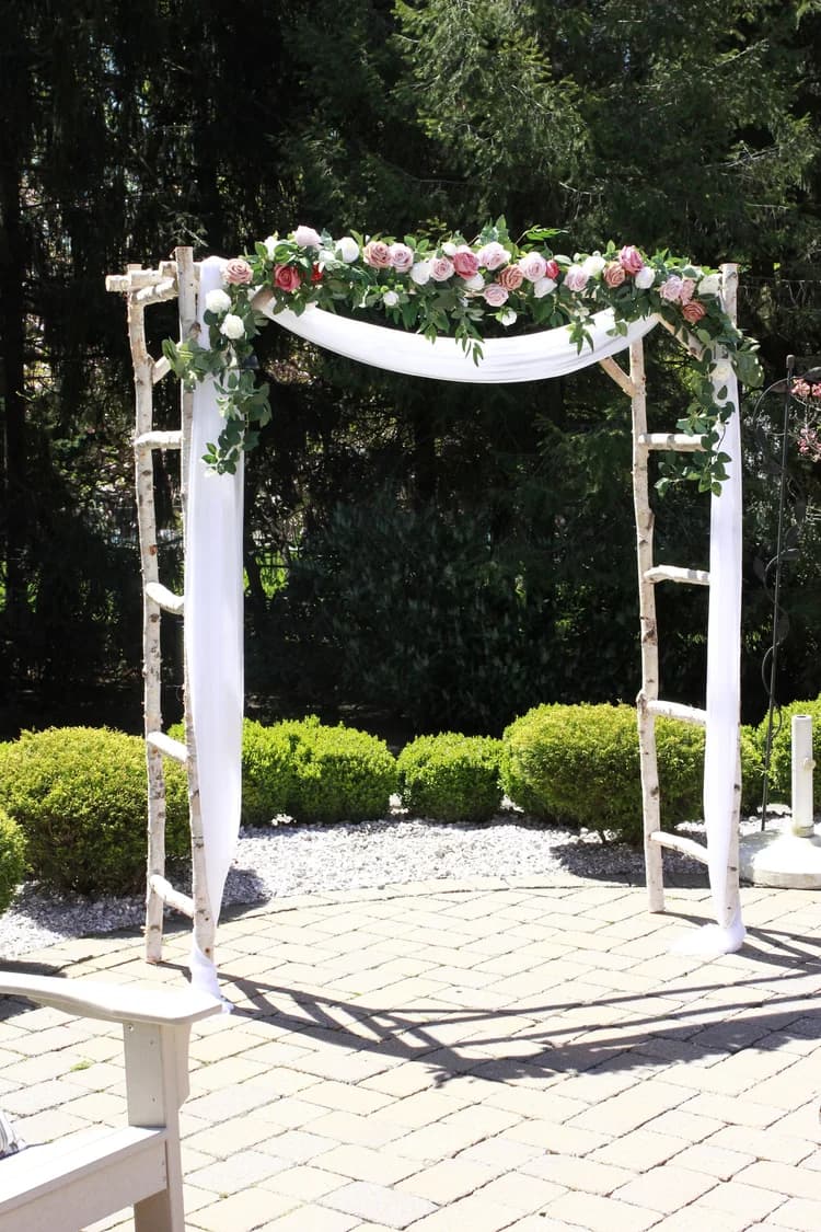 Classic birch arch styled for a wedding