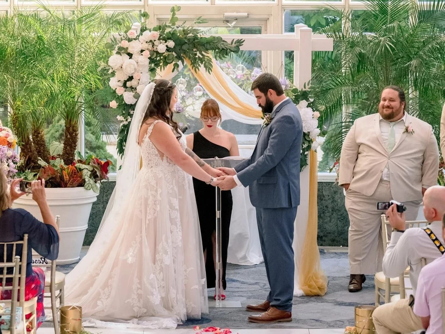 Traditional white wedding arch